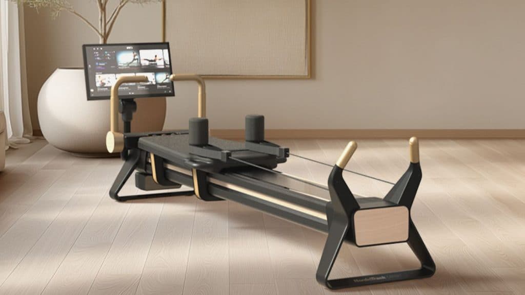 The NordicTrack Ultra 1 Reformer featuring a 24-inch HD touchscreen and Smart Spine™ enclosed resistance system, designed for connected Pilates training in a modern home environment.
